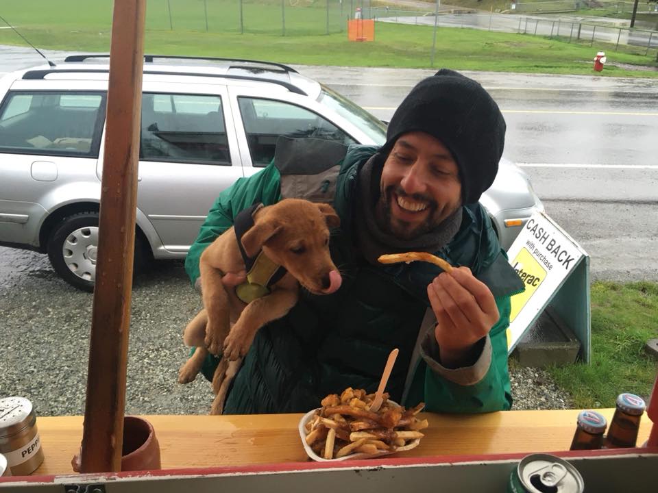 Al and his puppy Leo sharing a Poutine at Al's